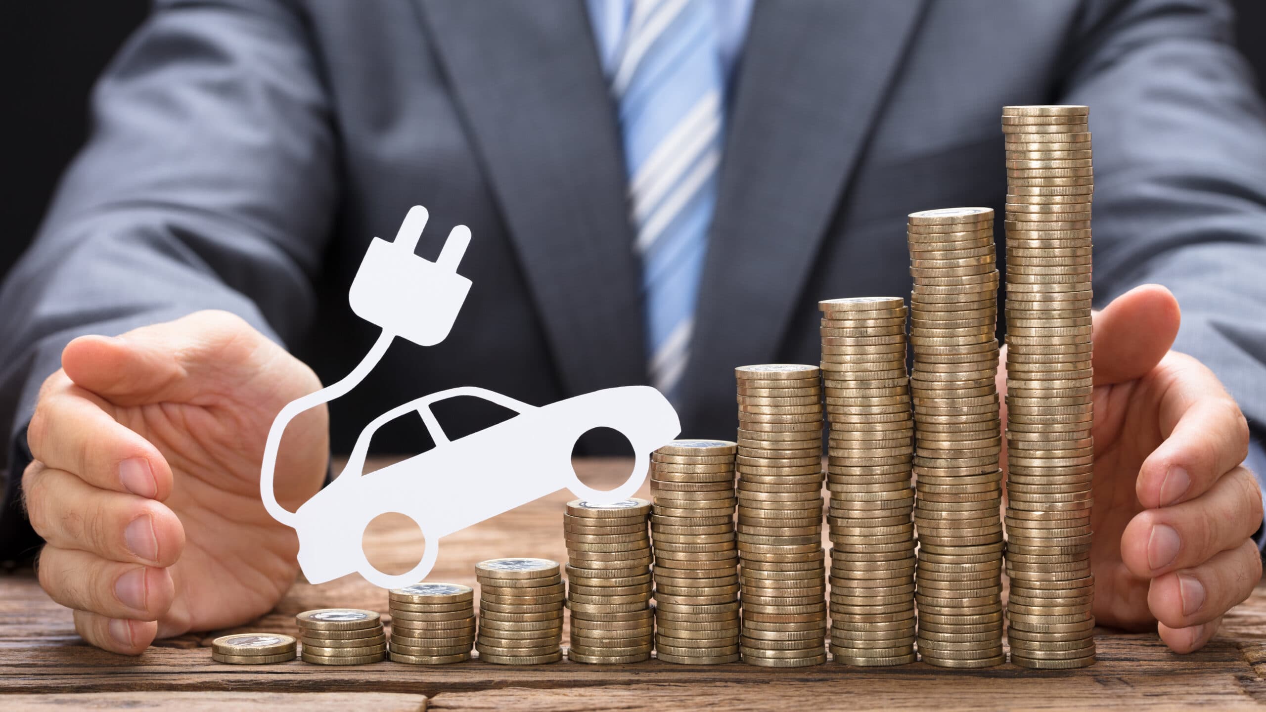 Electric vehicle charging station with cars parked.